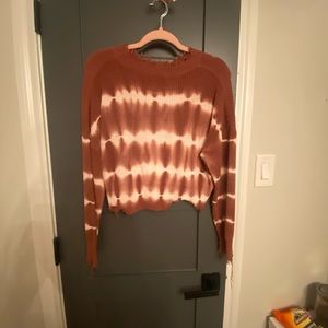 Red and white ripped sweater